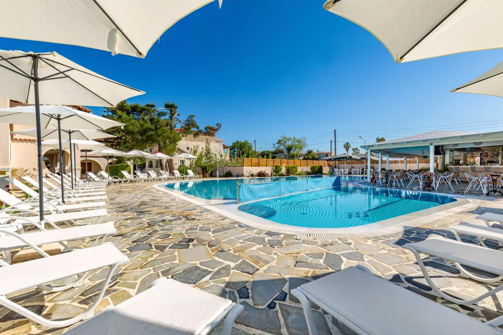 kamari apartments corfu acharavi pool area umbrellas